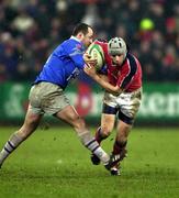 20 January 2001; Killian Keane of Munster is tackled by Philippe Garrigues of Castres during the Heineken Cup Pool 4 Round 6 match between Munster and Castres at Musgrave Park in Cork. Photo by Damien Eagers/Sportsfile