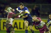 20 January 2001; Girvan Dempsey of Leinster is tackled by Serge Betsen, left, and Denis Avril of Biarritz during the Heineken Cup Pool 1 Round 6 match between Biarritz and Leinster at Park de Sport Aguilera in Biarritz, France. Photo by Matt Browne/Sportsfile