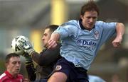 21 January 2001; Cork City goalkeeper Michael Devine saves from Dessie Baker of Shelbourne during the Eircom League Premier Division match between Cork City and Shelbourne at Turners Cross in Cork. Photo by Brendan Moran/Sportsfile