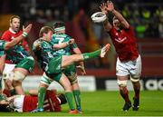 28 November 2015; Kieran Marmion, Connacht, kicks upfield under pressure from Donnacha Ryan, Munster. Guinness PRO12, Round 8, Munster v Connacht. Thomond Park, Limerick. Picture credit: Diarmuid Greene / SPORTSFILE