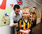 7 September 2009; Kilkenny's Derek Lyng signs an autograph for Kilkenny supporter Darragh Montaque, from Urlingford, Co. Kilkenny, during a visit to Our Lady's Hospital for Sick Chidren in Crumlin. Crumlin, Co. Dublin. Picture credit: Pat Murphy / SPORTSFILE