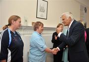 8 September 2009; President of the EU Parliament Jerzy Buzek MEP is greeted by Special Olympic athletes Sile Maguire, Gymnastics, from Marino, and Fiona Byrne, left, from Marino, during a visit to Special Olympics Europe/Eurasia Headquarters. 32 Morrison Chambers, Nassau Street, Dublin. Picture credit: Brian Lawles / SPORTSFILE