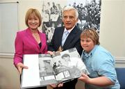 8 September 2009; President of the EU Parliament Jerzy Buzek MEP is presented with a book on Specail Olympic Athletes by Mary Davis, Managing Director of Special Olympics Europe/Eurasia, and Special Olympics athlete Sile Maguire, Gymnastics, from Marino, during a visit to Special Olympics Europe/Eurasia Headquarters. 32 Morrison Chambers, Nassau Street, Dublin. Picture credit: Brian Lawless / SPORTSFILE