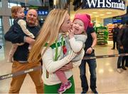 14 December 2015; Team Ireland athlete Lizzie Lee, who won a team bronze medal in the Senior Women's event, is welcomed home by her 18 month old daughter Lucy Kelleher in Dublin Airport on their return home from the SPAR European Cross Country Championship in France. Terminal 2, Dublin Airport, Dublin. Photo by Sportsfile