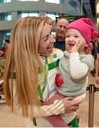 14 December 2015; Team Ireland athlete Lizzie Lee, who won a team bronze medal in the Senior Women's event, is welcomed home by her 18 month old daughter Lucy Kelleher in Dublin Airport on their return home from the SPAR European Cross Country Championship in France. Terminal 2, Dublin Airport, Dublin. Photo by Sportsfile