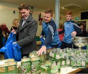 21 December 2015; Dublin footballers Paddy Andrews, goalkeeper coach Davy Byrne, and Conor McHugh as they help pack some 3,000 Christmas parcels for the homeless at the Capuchin Day Centre on Bow Street, Dublin. Picture credit: Ray McManus / SPORTSFILE