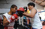 22 September 2009; Poonsawat Kratingdaenggym in action with his trainer Anan Tualve during a media workout ahead of his Hunky Dorys World Title fight against Bernard Dunne in The O2, Dublin, on Saturday September 26th. Bridgestone Muay Thai Gym, Stonybatter. Picture credit: Matt Browne / SPORTSFILE *** Local Caption ***