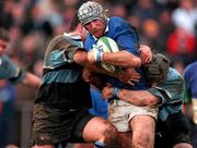 10 February 2001; Trevor Brennan of St Mary's College is tackled by Johnny O'Connor and Barry Gavin of Galwegians during the AIB All-Ireland League Division 1 match between St Mary's College and Galwegians at Templeville Road in Dublin. Photo by Ray Lohan/Sportsfile