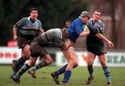 10 February 2001; Gareth Logan of St Mary's College is tackled by Johnny O'Connor, left, and Eric Elwood of Galwegians during the AIB All-Ireland League Division 1 match between St Mary's College and Galwegians at Templeville Road in Dublin. Photo by Brendan Moran/Sportsfile