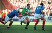 17 February 2001; Rob Heffernan of Ireland is tackled by Christophe Juillet, left, and Richard Dourthe of France during the Lloyds TSB Six Nations Rugby Championship match between Ireland and France at Lansdowne Road in Dublin. Photo by Brendan Moran/Sportsfile