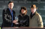 3 January 2015; Winning trainer Willie Mullins, right, with wife Jackie, are presented with the trophy by Niall Quinn, left, after their horse, Bellshill, with Ruby Walsh up, won the Lawlor's Hotel Novice Hurdle. Horse Racing from Naas. Naas, Co Kildare. Picture credit: Seb Daly / SPORTSFILE