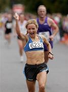 26 September 2009; Donna Mahon, Rathfarnham WSAF , crosses the line to take second place in the Lifestyle Sports - adidas Dublin Half Marathon. Phoenix Park, Dublin. Picture credit: Tomas Greally / SPORTSFILE