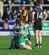 4 October 2009; Fintan Devlin and Aidan McAlynn, Loup St Patrick's, hug each other at the final whistle. Derry County Senior Football Final, Dungiven St Canice's v Loup St Patrick's, Celtic Park, Derry. Picture credit: Oliver McVeigh / SPORTSFILE