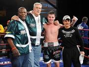 10 October 2009; John Duddy celebrates his victory over Michi Munoz, with, from left, trainer Harry Keitt, George Mitchell and Orlando Carrasquillo. Latin Fury 12 Fight Night, John Duddy v Michi Munoz. Madison Square Garden, New York. Picture credit: Stephen McCarthy / SPORTSFILE