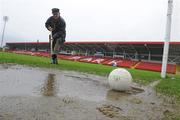 1 November 2009; Seamus Mullan, Chairman of Celtic Park, grounds committee, spikes the water logged pitch at Celtic Park. AIB GAA Football Ulster Senior Club Championship Quarter-Final, Loup v Derrygonnelly, Celtic Park, Derry, Co. Derry. Picture credit: Oliver McVeigh / SPORTSFILE