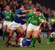 17 February 2001; David Wallace of Ireland is tackled by Xavier Garbajosa of France during the Lloyds TSB Six Nations Rugby Championship match between Ireland and France at Lansdowne Road in Dublin. Photo by Brendan Moran/Sportsfile