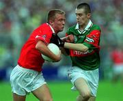 24 September 2000; Conrad Murphy of Cork is tackled by Enda Devenney of Mayo during the All Ireland Minor Football Championship Final match between Cork and Mayo at Croke Park in Dublin. Photo by Matt Browne/Sportsfile