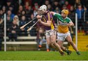 24 January 2016; Liam Ryan, Wexford, in action against Shane Kinsella, Offaly. Bord na Mona Walsh Cup, Semi-Final, Wexford v Offaly, Kennedy Park, New Ross, Co. Wexford. Picture credit: Sam Barnes / SPORTSFILE