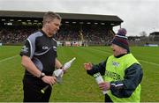 6 February 2016; Ruairí Óg mascot John McKillop in conversation with linesman Barry Kelly before the game. AIB GAA Hurling Senior Club Championship, Semi-Final, Sarsfields v Ruairi Og. Páirc Táilteann, Navan, Co. Meath. Picture credit: Piaras Ó Mídheach / SPORTSFILE