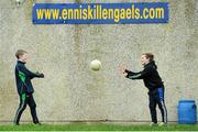 7 February 2016; Eoin Fee, age 9, and Michael Lafferty, age 10, from Tempo, Co. Fermanagh, hand pass a ball between them before the start of the match. Allianz Football League, Division 2, Round 2, Fermanagh v Meath. Brewster Park, Enniskillen, Co. Fermanagh. Picture credit: Seb Daly / SPORTSFILE