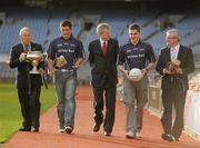 10 December 2009; Student GAA stars Ross O'Carroll, Dublin / UCD, left, and Daniel Goulding, Cork / CIT, right, are pictured pitch side in Croke Park with Ard Stiúrthoir Lúthchleas Gael Paraic Duffy, centre, Michael Mallie, Chairman of Higher Education, GAA, extreme left, Sean Martyn, Director, Business Banking Area East, Ulster Bank, extreme right, as the 2010 Higher Education Championship draws took place. Cork Institute of Technology and University College Cork will defend their respective Ulster Bank Sigerson and Fitzgibbon Cup crowns in the highly anticipated 2010 Championships. Over 100 teams will be battling it in all divisions for a place at the finals weekend hosted by NUI Maynooth (football) and NUI Galway (hurling). 2010 Ulster Bank Sigerson and Fitzgibbon Cup Draws, Croke Park, Dublin. Picture credit: Pat Murphy / SPORTSFILE