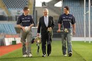 10 December 2009; Student GAA stars Daniel Goulding, Cork / CIT, right, and Ross O'Carroll, Dublin / UCD, left, are pictured pitch side in Croke Park with Sean Martyn, Director, Business Banking Area East, Ulster Bank, as the 2010 Higher Education Championship draws took place. Cork Institute of Technology and University College Cork will defend their respective Ulster Bank Sigerson and Fitzgibbon Cup crowns in the highly anticipated 2010 Championships. Over 100 teams will be battling it in all divisions for a place at the finals weekend hosted by NUI Maynooth (football) and NUI Galway (hurling). 2010 Ulster Bank Sigerson and Fitzgibbon Cup Draws, Croke Park, Dublin. Picture credit: Pat Murphy / SPORTSFILE