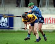 1 April 2001; Frank Lohan of Clare is tackled by Ger Ennis of Dublin during the Allianz National Hurling League Division 1A match between Dublin and Clare at Parnell Park in Dublin. Photo by Ray McManus/Sportsfile