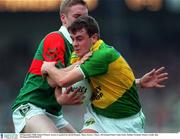 28 September 1997; Denis O'Dwyer, Kerry, is tackled by David Heaney, Mayo. Kerry v Mayo, All Ireland Final, Croke Park, Dublin, Football. Picture credit; Ray McManus / SPORTSFILE