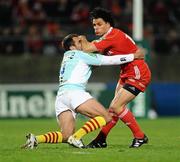 11 December 2009; Doug Howlett, Munster, is tackled by David Marty, Perpignan. Heineken Cup Pool 1 Round 3, Munster v Perpignan, Thomond Park, Limerick. Picture credit: Stephen McCarthy / SPORTSFILE