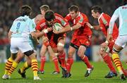 11 December 2009; Donncha O'Callaghan, Munster, is tackled by Perry Freshwater, and Nicolas Durand, 9, Perpignan. Heineken Cup Pool 1 Round 3, Munster v Perpignan, Thomond Park, Limerick. Picture credit: Diarmuid Greene / SPORTSFILE