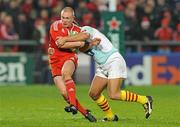 11 December 2009; Keith Earls, Munster, is tackled by Gavin Hume, Perpignan. Heineken Cup Pool 1 Round 3, Munster v Perpignan, Thomond Park, Limerick. Picture credit: Diarmuid Greene / SPORTSFILE