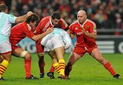 11 December 2009; Munster's Donncha O'Callaghan, left, Alan Quinlan, centre, and John Hayes combine to tackle Charles Geli, Perpignan. Heineken Cup Pool 1 Round 3, Munster v Perpignan, Thomond Park, Limerick. Picture credit: Diarmuid Greene / SPORTSFILE