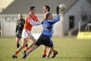 16 January 2010; Peter Hughes, UUJ, Derry, in action against Shane O'Neill and Colm Waters, Armagh. Barrett Sports Lighting Dr. McKenna Cup, Group A, Armagh v UUJ, Derry, St Oliver Plunkett Park, Crossmaglen, Co. Armagh. Picture credit: Oliver McVeigh / SPORTSFILE