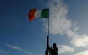 17 January 2010; Seamus Lennon from Ballymahon puts up the tricolour prior to the game. O'Byrne Cup, First Round, Longford v Meath, Ballymahon GAA Club, Ballymahon, Co. Longford. Photo by Sportsfile