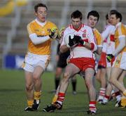 17 January 2010; Gerard O'Kane, Derry, in action against Gerard O'Boyle and Eoin O'Neill, Antrim. Barrett Sports Lighting Dr. McKenna Cup, Group C, Antrim v Derry, Casement Park, Belfast, Co. Antrim. Picture credit: Oliver McVeigh / SPORTSFILE