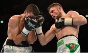 27 February 2016; Conrad Cummings, right, exchanges punches with Victor Garcia during their middleweight bout. Manchester Arena, Manchester, England. Picture credit: Ramsey Cardy / SPORTSFILE