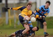 3 February 2010; Brian Sheridan, DCU, scores his side's first goal despite the challenge of Michael Savage and Rory O'Carroll, UCD. Ulster Bank Sigerson Cup, Round 2, Dublin City University v University College Dublin, DCU Sportsground, Dublin. Picture credit: Pat Murphy / SPORTSFILE