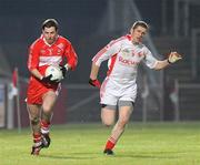 6 February 2010; Gerard O'Kane, Derry, in action against Kevin Hughes, Tyrone. Allianz GAA Football National League, Division 1, Round 1, Derry v Tyrone, Celtic Park, Derry. Picture credit: Oliver McVeigh / SPORTSFILE