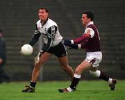 21 April 2001; Nigel Clancy of Sligo gets the ball away under pressure from Padraic Joyce of Galway during the Allianz GAA National Football League Division 1 Semi-Final match between Galway and Sligo in Dr Hyde Park in Roscommon. Photo by Damien Eagers/Sportsfile