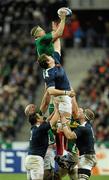 13 February 2010; Jamie Heaslip, Ireland, takes the ball in a lineout ahead of Pascal Pape, France. RBS Six Nations Rugby Championship, France v Ireland, Stade de France, Saint Denis, Paris, France. Picture credit: Brian Lawless / SPORTSFILE