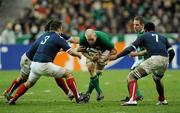 13 February 2010; Paul O'Connell, Ireland, is tackled by, from left, Mathieu Bastareaud, Nicolas Mas and Fulgence Ouedraogo, France. RBS Six Nations Rugby Championship, France v Ireland, Stade de France, Saint Denis, Paris, France. Picture credit: Brian Lawless / SPORTSFILE