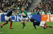 13 February 2010; Keith Earls, Ireland, is tackled by Thomas Domingo, right, and theirry Dusautoir, France. RBS Six Nations Rugby Championship, France v Ireland, Stade de France, Saint Denis, Paris, France. Picture credit: Brian Lawless / SPORTSFILE