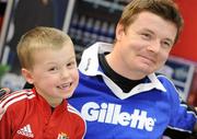 15 February 2010; Luke McGill, age 4, from Rathfarnham, Co. Dublin, poses for a picture with Gillette Ambassador and Irish Rugby captain Brian O’Driscoll at an in-store signing in Dunnes Stores, Cornelscourt, on Monday evening. The rugby hero took the time to sign autographs and meet hundreds of fans as he launched the Gillette Fusion limited edition Irish handle razor. A limited edition razor has been specially designed donning the Irish colours to show Ireland’s pride in the rugby star and his Irish team-mates. The crowd were delighted to get the opportunity to meet the rugby star before he lines out for his next RBS 6 Nations match against England. Dunnes Stores, Cornelscourt, Dublin. Picture credit: Brendan Moran / SPORTSFILE