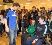 15 February 2010; Gillette Ambassador and Irish Rugby captain Brian O’Driscoll chats to Matthew O'Connor, age 11, from Cork, and Cian Finlay, right, from Ardee, Co. Louth, at an in-store signing in Dunnes Stores, Cornelscourt, on Monday evening. The rugby hero took the time to sign autographs and meet hundreds of fans as he launched the Gillette Fusion limited edition Irish handle razor. A limited edition razor has been specially designed donning the Irish colours to show Ireland’s pride in the rugby star and his Irish team-mates. The crowd were delighted to get the opportunity to meet the rugby star before he lines out for his next RBS 6 Nations match against England. Dunnes Stores, Cornelscourt, Dublin. Picture credit: Brendan Moran / SPORTSFILE