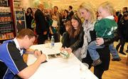 15 February 2010; Gillette Ambassador and Irish Rugby captain Brian O’Driscoll signs autographs for the Cotter family, Tim, left, Molly, Geraldine and Roddy, from Blackrock, Dublin, at an in-store signing in Dunnes Stores, Cornelscourt, on Monday evening. The rugby hero took the time to sign autographs and meet hundreds of fans as he launched the Gillette Fusion limited edition Irish handle razor. A limited edition razor has been specially designed donning the Irish colours to show Ireland’s pride in the rugby star and his Irish team-mates. The crowd were delighted to get the opportunity to meet the rugby star before he lines out for his next RBS 6 Nations match against England. Dunnes Stores, Cornelscourt, Dublin. Picture credit: Brendan Moran / SPORTSFILE