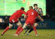 20 February 2010; Shane Horgan, Leinster, is tackled by Dominic Day, left, and Damian Welch, Scarlets. Celtic League, Leinster v Scarlets. RDS, Dublin. Picture credit: Stephen McCarthy / SPORTSFILE