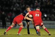 20 February 2010; Devin Toner, Leinster, is tackled by Johnathan Edwards, left, and Ken Owens, Scarlets. Celtic League, Leinster v Scarlets. RDS, Dublin. Picture credit: Stephen McCarthy / SPORTSFILE