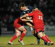20 February 2010; Devin Toner, Leinster, is tackled by Johnathan Edwards, left, and Ken Owens, Scarlets. Celtic League, Leinster v Scarlets. RDS, Dublin. Picture credit: Stephen McCarthy / SPORTSFILE