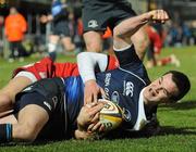 20 February 2010; Jonathan Sexton, Leinster, goes over for his side's second try despite the attention of Gareth Maule, Scarlets. Celtic League, Leinster v Scarlets. RDS, Dublin. Picture credit: Stephen McCarthy / SPORTSFILE