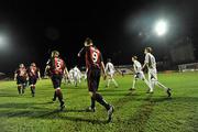 5 March 2010; Players from both Bohemians and Sporting Fingal walk out for the start of the first game of the new season. Airtricity League, Premier Division, Bohemians v Sporting Fingal, Dalymount Park, Dublin. Picture credit: David Maher / SPORTSFILE